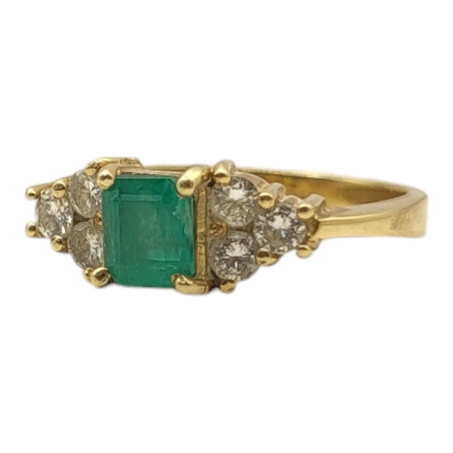 3A - AN 18CT GOLD, EMERALD AND DIAMOND RING
The central square cut emerald edged with round cut diamonds.... 