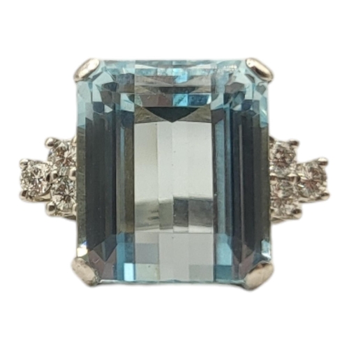 5A - AN 18CT WHITE GOLD, AQUAMARINE AND DIAMOND RING
The rectangular stepped cut stone flanked by round c... 