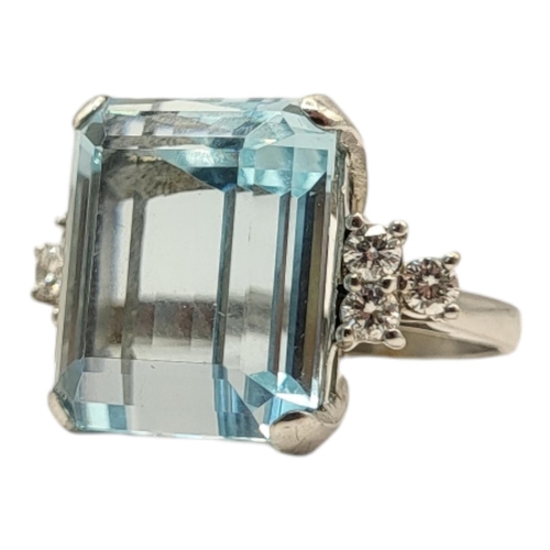 5A - AN 18CT WHITE GOLD, AQUAMARINE AND DIAMOND RING
The rectangular stepped cut stone flanked by round c... 