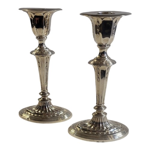 105 - A PAIR OF FINE EDWARDIAN JAMES DIXON & SON STERLING SILVER ROBERT ADAM STYLE DESKTOP CANDLESTICKS
Sh... 