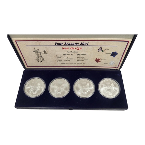 115 - A SET OF FOUR AMERICAN SILVER AND ENAMEL 1 oz DOLLAR PROOF COINS,titled ‘Four Seasons 2001’
In prote... 