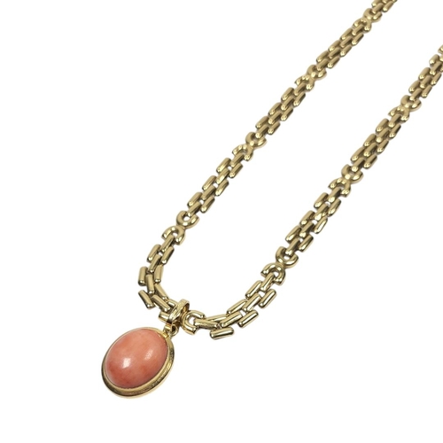 124 - A 20TH CENTURY 18CT GOLD AND PINK CORAL PENDANT NECKLACE
Set with an oval cabochon cut coral pendant... 