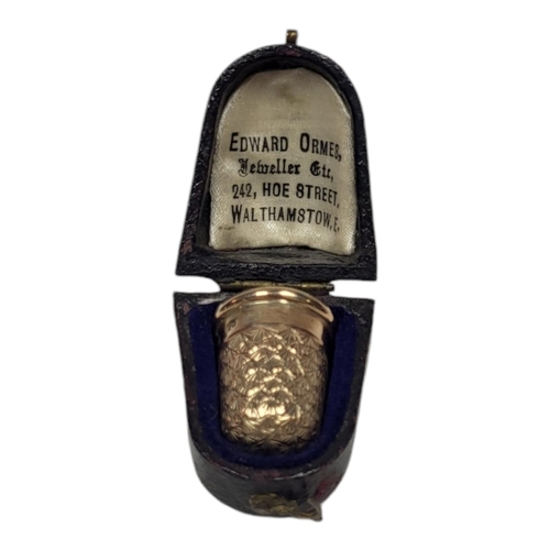 153 - CHARLES HORNER, A VICTORIAN 9CT GOLD SEWING THIMBLE
Having engraved decoration, in a fitted velvet l... 