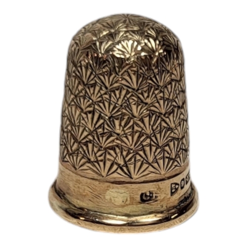 153 - CHARLES HORNER, A VICTORIAN 9CT GOLD SEWING THIMBLE
Having engraved decoration, in a fitted velvet l... 