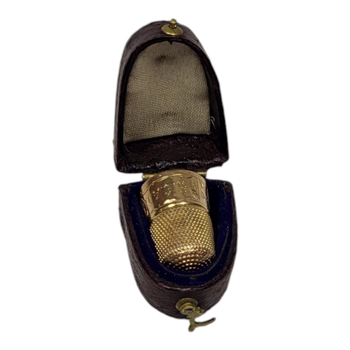 154 - A VICTORIAN 15CT GOLD SEWING THIMBLE
Having engraved decoration, in a fitted velvet lined leather bo... 