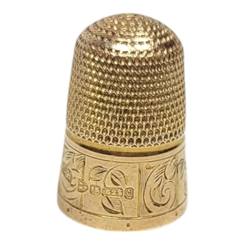 154 - A VICTORIAN 15CT GOLD SEWING THIMBLE
Having engraved decoration, in a fitted velvet lined leather bo... 