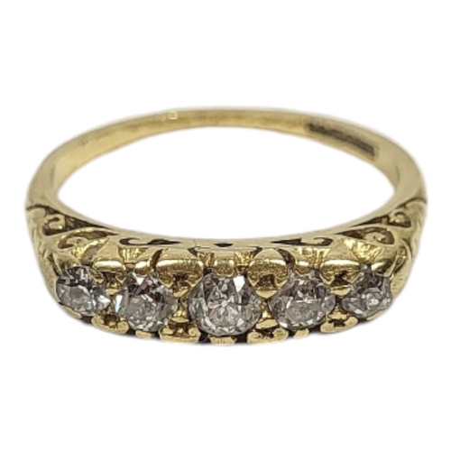 16 - AN 18CT GOLD AND DIAMOND FIVE STONE RING
Having a row of graduated round cut diamonds.
(central ston... 