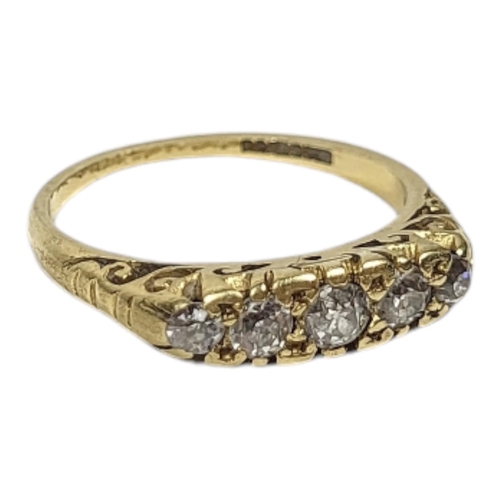 16 - AN 18CT GOLD AND DIAMOND FIVE STONE RING
Having a row of graduated round cut diamonds.
(central ston... 