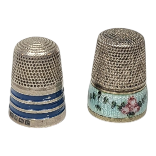 160 - AN EDWARDIAN WHITE METAL AND ENAMEL SEWING THIMBLE
Having floral decoration to base, together with a... 