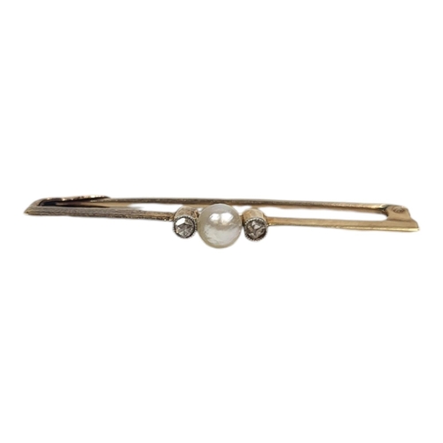 17 - A VINTAGE YELLOW METAL,PEARL AND DIAMOND BAR BROOCH
The central pearl flanked by two round cut diamo... 