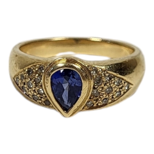 19 - AN 18CT GOLD, SAPPHIRE AND DIAMOND RING
The pear cut sapphire flanked by diamond chips.
(sapphire ap... 