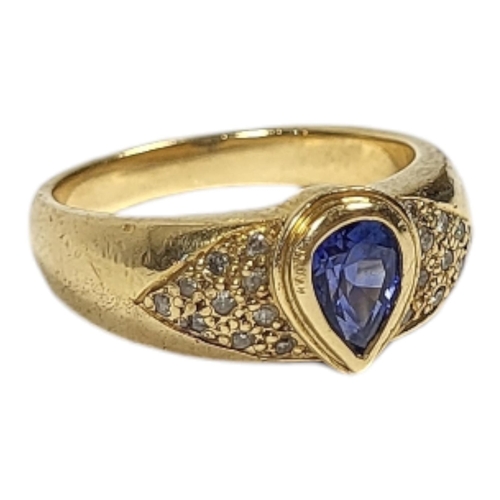 19 - AN 18CT GOLD, SAPPHIRE AND DIAMOND RING
The pear cut sapphire flanked by diamond chips.
(sapphire ap... 