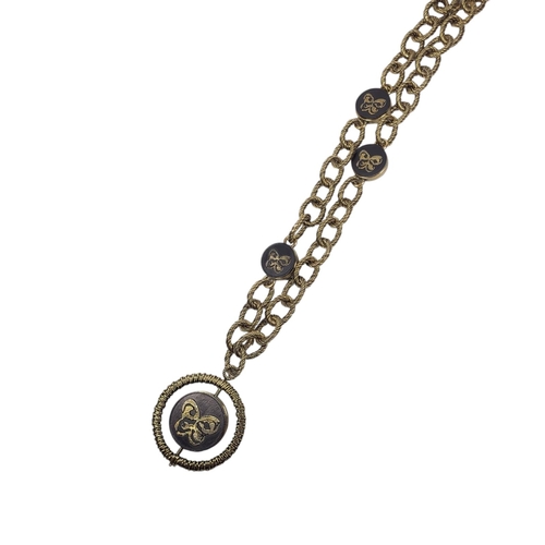 22 - BOTTEGA VENETA, A SILVER GILT NECKLACE
Heavy gauge rope twist links with ebonised wooden spacers and... 