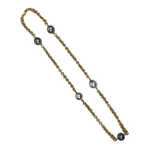 24 - AN 18CT GOLD AND CULTURED PEARL NECKLACE
Set with five grey/black tone cultured pearls.
(approx 35cm... 