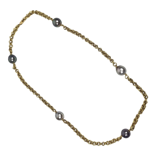 24 - AN 18CT GOLD AND CULTURED PEARL NECKLACE
Set with five grey/black tone cultured pearls.
(approx 35cm... 