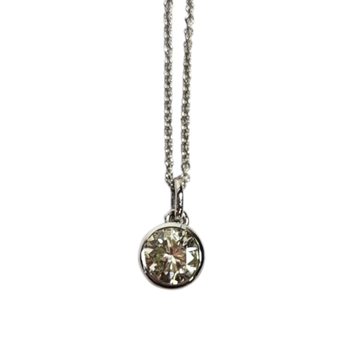 31 - A WHITE METAL AND 1ct DIAMOND PENDANT NECKLACE
Round cut stone in a collect mount,on an 18ct white g... 