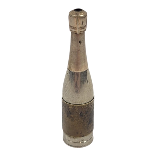 52 - AN EARLY 20TH CENTURY GERMAN WHITE METAL NOVELTY CHAMPAGNE BOTTLE PROPELLING PENCIL
Having yellow me... 