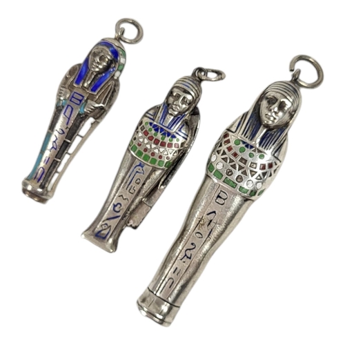 53 - TWO EARLY 20TH CENTURY WHITE METAL AND ENAMEL EGYPTIAN REVIVAL PROPELLING PENCILS
Together with a pe... 