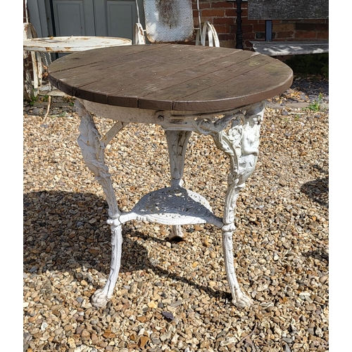 576 - A VICTORIAN CAST IRON BRITANNIA TABLE
With circular teak top, three legs and under tier.
(diameter 5... 