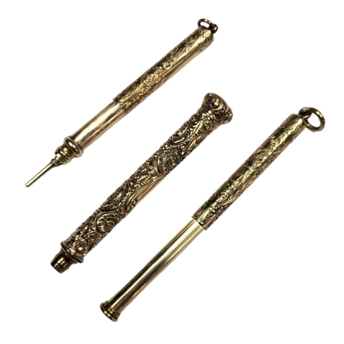 61 - A COLLECTION OF THREE YELLOW METAL PROPELLING PENCILS
Having fine engraved decoration.
(approx 7cm)
... 