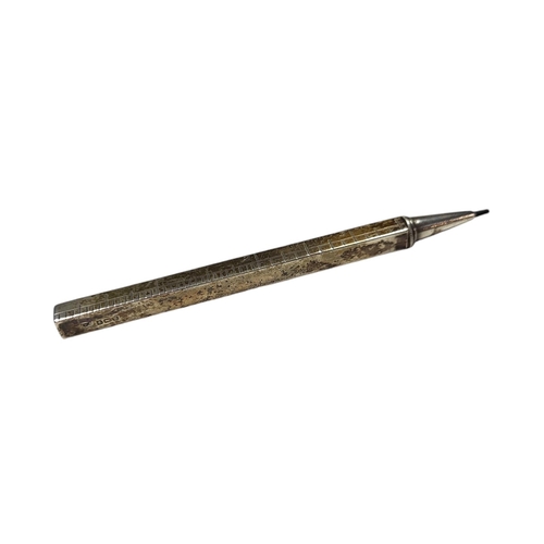 63 - AN EARLY 20TH CENTURY SILVER PROPELLING PENCIL AND EXTENDING RULER
Four section opening to 9 inches,... 