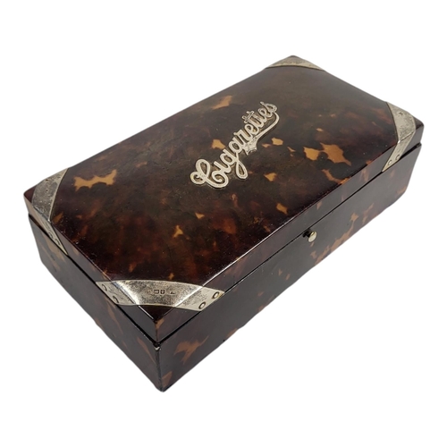 68 - AN EARLY 20TH CENTURY SILVER AND TORTOISESHELL CIGARETTE BOX
Rectangular form, with hallmarked silve... 