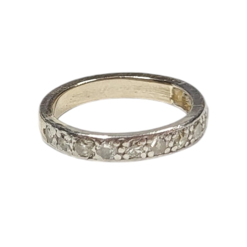 69 - A VINTAGE WHITE METAL AND DIAMOND HALF ETERNITY RING
Having a row of round cut diamonds in a plain d... 