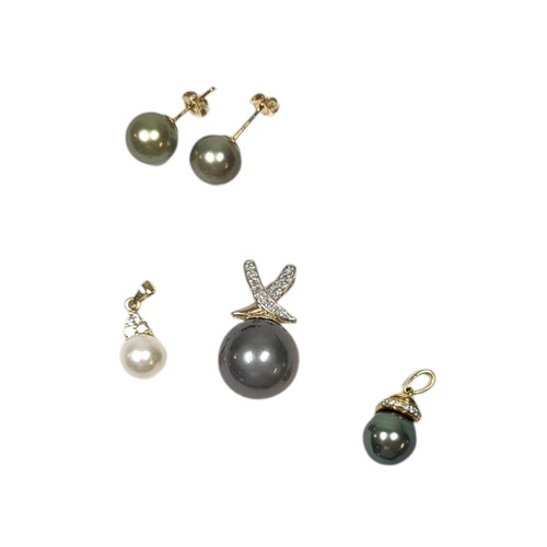 15 - A COLLECTION OF THREE VINTAGE 9CT GOLD AND DIAMOND PENDANTS
To include a black pearl with kiss desig... 