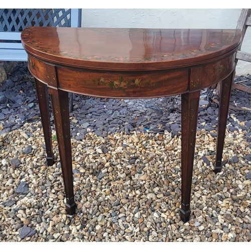 580 - AN ADAMS REVIVAL MAHOGANY AND FLORAL PAINTED HALF MOON CARD TABLE
The fold over top enclosing green ... 