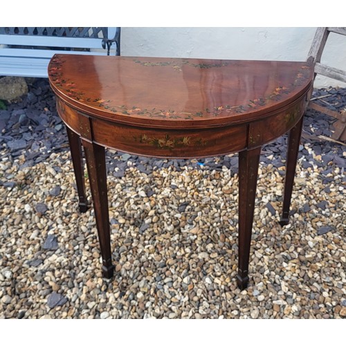 580 - AN ADAMS REVIVAL MAHOGANY AND FLORAL PAINTED HALF MOON CARD TABLE
The fold over top enclosing green ... 