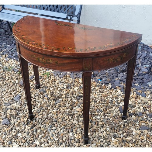 580 - AN ADAMS REVIVAL MAHOGANY AND FLORAL PAINTED HALF MOON CARD TABLE
The fold over top enclosing green ... 