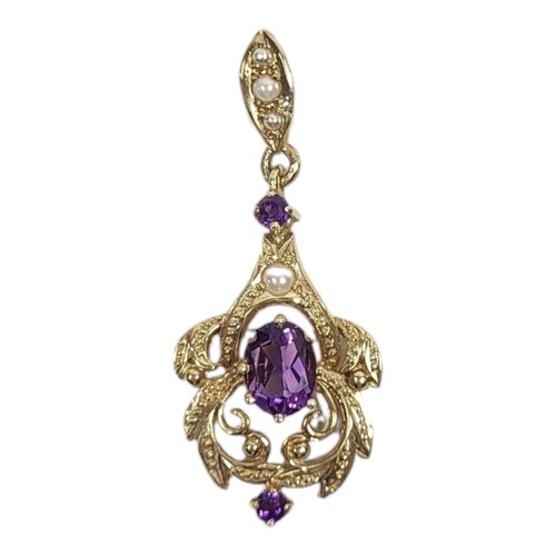 651 - A VINTAGE 9CT GOLD, AMETHYST AND SEED PEARL PENDANT
The central oval cut amethyst in a pierced desig... 