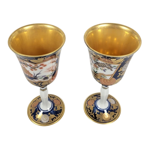 824 - A PAIR OF 20TH CENTURY JAPANESE EXPORT LUXURIOUS PORCELAIN GOBLETS
Imari palette, with inverted balu... 