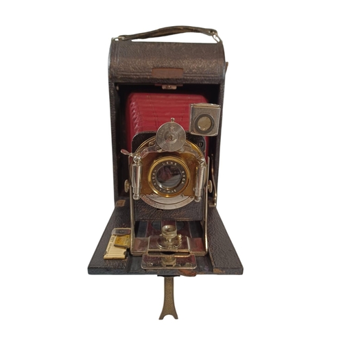 452 - BECK CORNEX. A large format roll film camera with red bellows. Mahogany body, covered in black leath... 