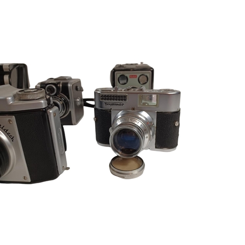 454 - POLAROID, BENCINI, ZEISS, VOIGTLANDER, KODAK, GOLDECK. A collection of 8 cameras including a Bencini... 