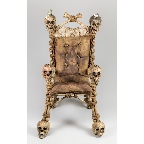 1 - AN UNUSUAL LATE 20TH CENTURY SKULL ARMCHAIR MOVIE PROP.
(h 137cm x w 80cm x d 96cm)