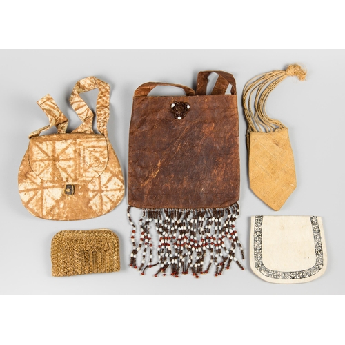 105 - A COLLECTION OF SOLOMON ISLANDS HANDMADE BAGS AND PURSES, 1960S-1970S. 
Largest (h 36cm).
Provenance... 