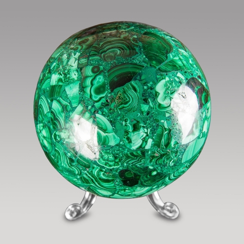 126 - A MALACHITE SPHERE.
900g. Size excluding base (h 8cm)