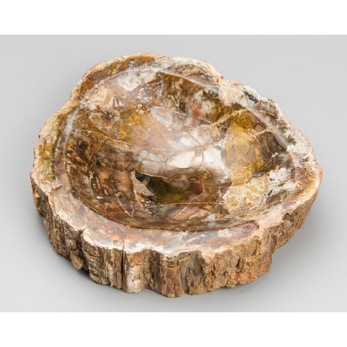 149 - A PETRIFIED FOSSIL WOOD BOWL.
2kg (h 5cm x w 19cm x d 18.5cm)