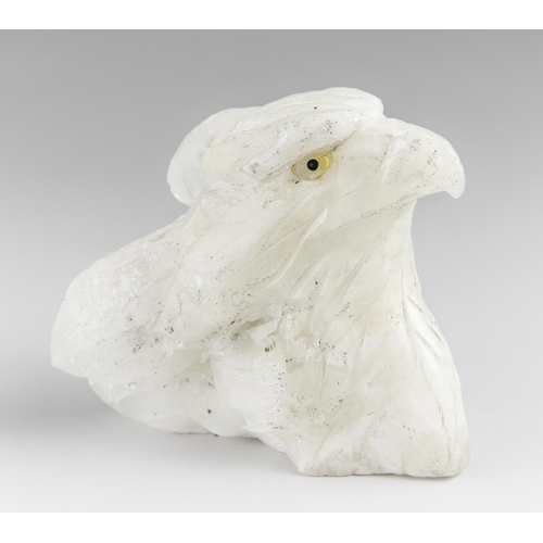 190 - A QUARTZ CRYSTAL CARVED EAGLE HEAD.
1.3kg. (h 12.5cm x w 14cm x d 9cm)