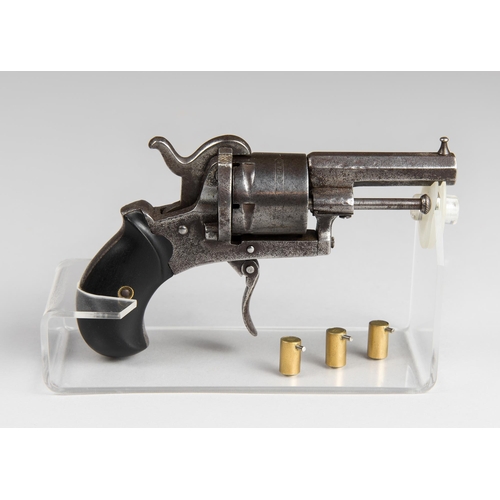 191 - A 19TH CENTURY POCKET REVOLVER.
With 3 homemade caps and custom stand. In good working order. (w 15c... 