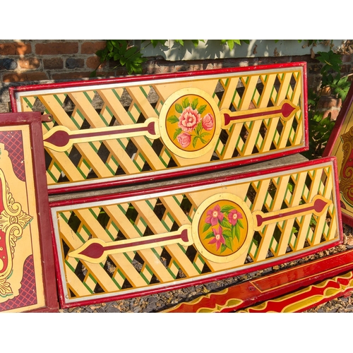 43 - A PAIR OF EARLY 20TH CENTURY FAIRGROUND HOOPLA (OR ‘ROUND STALL’) TOP PANELS. 
With flower cartouche... 