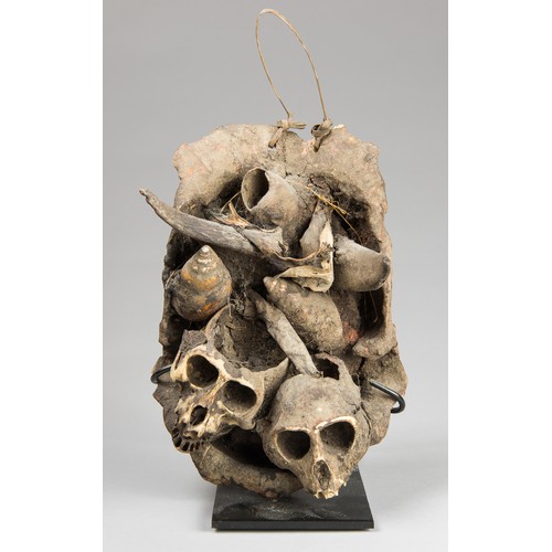 70 - A LATE 19TH CENTURY WEST AFRICAN TRIBAL MONKEY SKULL BASKET.

With custom stand. (h 25.5cm)

Provena... 