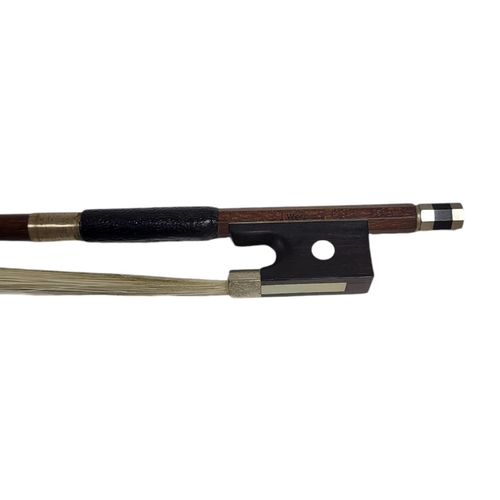 546 - WERNER, A HALF SIZE VIOLIN BOW
Round stick, ebony frog pearl, stamped.
(54g, 61.5cm)

Condition: som... 