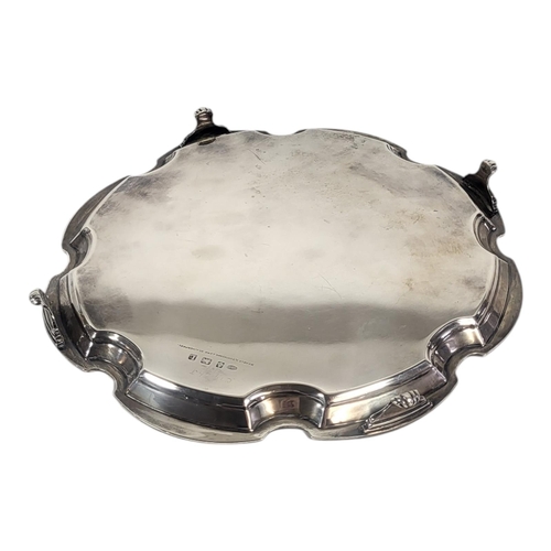 555 - BOODLE & DUNTHORNE OF LORD ST. LIVERPOOL, A SOLID SILVER WAITER SALVER, BIRMINGHAM, 1935
With geomet... 