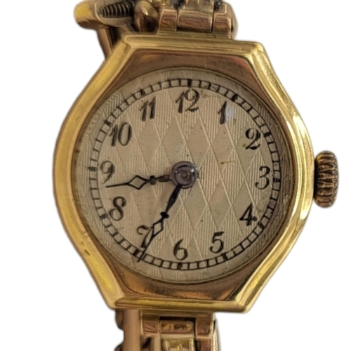 688 - AN EARLY 20TH CENTURY 9CT GOLD LADIES’ COCKTAIL WATCH
Silver tone dial, on expanding bracelet strap,... 