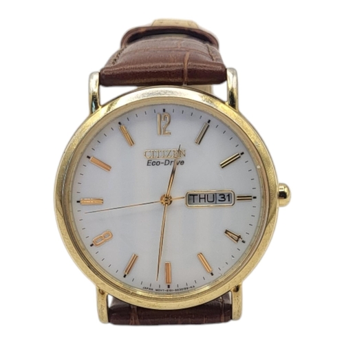 689 - CITIZEN, A GOLD PLATED ‘ECO DRIVE‘ GENT’S WRISTWATCH
White tone dial with Day/Date dials, on brown l... 