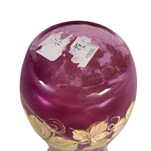 704 - WITHDRAWN A 20TH CENTURY CONTINENTAL CRANBERRY GLASS VASE
Hand painted with an exotic bird and flora... 