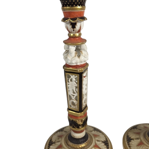 705 - A PAIR OF 19TH CENTURY CONTINENTAL FIGURAL CANDLESTICKS
Having pierced figural busts to central colu... 