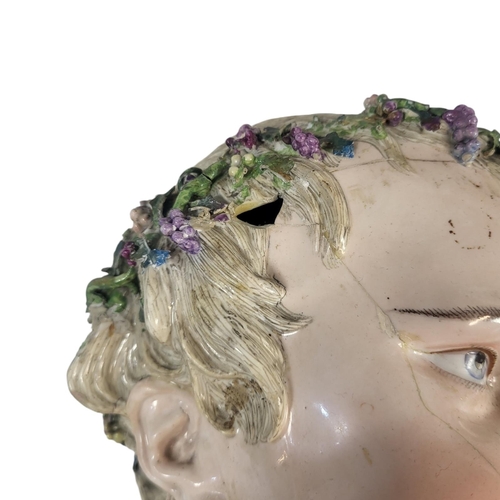 707 - AFTER MEISSEN, A LARGE 19TH CENTURY ‘KINDERKOPF’ PORCELAIN BUST
Young Bacchus wearing a wreath of vi... 